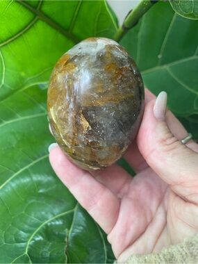 Large fire quartz in smoky quartz polished crystal palm stone
